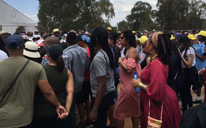 Scores of people making their way through one of the gates at the FNB stadium for the Global Citizen concert on 2 December 2018. Picture: Katleho Sekhotho/EWN
