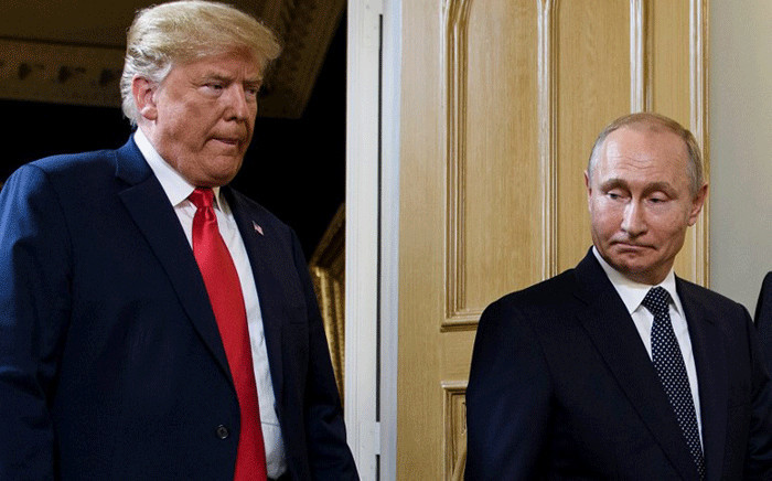 In this file photo taken on 16 July 2018 US President Donald Trump (L) and Russian President Vladimir Putin arrive for a meeting in Helsinki. Picture: AFP.