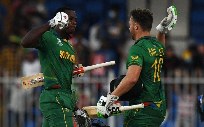 South Africa's David Miller (R) and teammate Kagiso Rabada celebrate their win in the ICC men’s Twenty20 World Cup cricket match between South Africa and Sri Lanka at the Sharjah Cricket Stadium in Sharjah on October 30, 2021. Picture: Indranil Mukherjee / AFP.