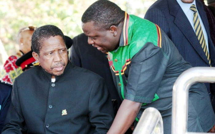 FILE: Edgar Lungu (l) talks to foreign affairs minister Harry Kalaba during a military exhibition march past on 24 October, 2014 to mark Zambia's 50th Independence celebration. Picture: AFP.