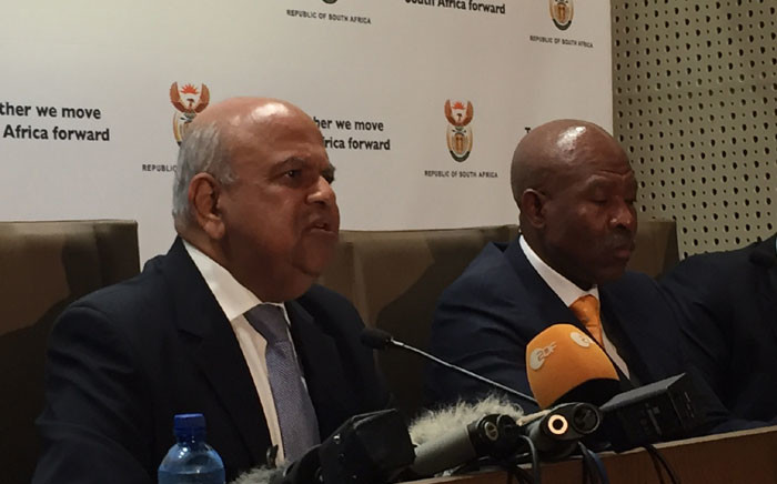 New Finance Minister Pravin Gordhan addressed the media flanked by his deputy Mcebisi Jonas and the Reserve Bank Governor Lesetja Kganyago in Pretoria. Picture: Vumani Mkhize/EWN. 
