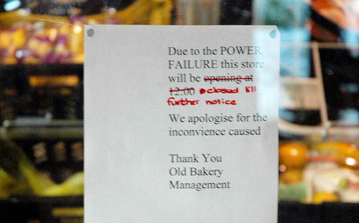 FILE: A business notifies customers of its closure due to power cuts. Picture: AFP