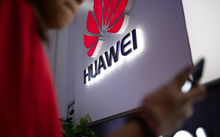 FILE: In this photo taken on 27 May 2019, a Huawei logo is displayed at a retail store in Beijing. Picture: AFP