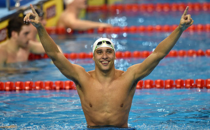 Chad le Clos celebrate after winning gold in the men’s 100m butterfly in Doha. Picture: Facebook.