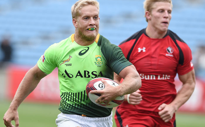 File: South Africa's Kyle Brown (L) runs in a try against Canada at the 2015 Tokyo Rugby Sevens. Picture: AFP