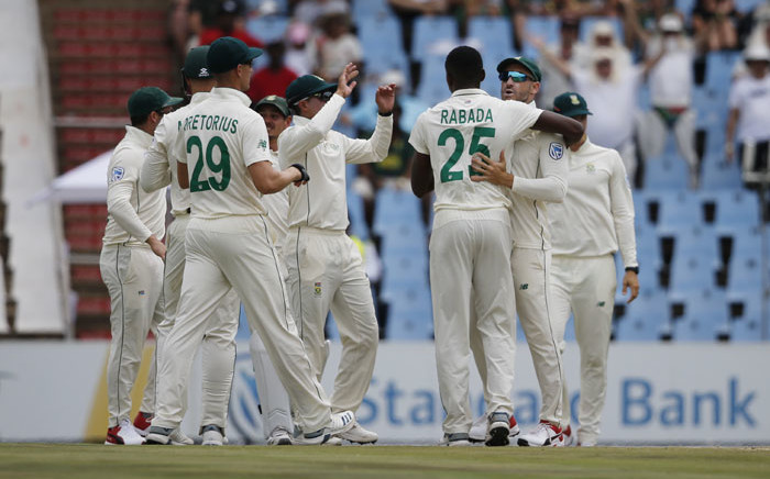 South Africa's Kagiso Rabada (3rd right) celebrates with his teammates after the dismissal of England's Dom Sibley during the second day of the first Test cricket match between South Africa and England at The SuperSport Park stadium at Centurion near Pretoria on 27 December 2019. Picture: AFP