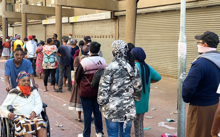 People queuing at pay out points in Mitchells Plain Town Centre on 30 March 2020 to collect their social grants. Picture: Kaylynn Palm/EWN.