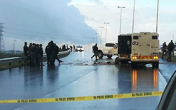 Officials on scene where a cash-in-transit heist took place on Jakes Gerwel Drive in Cape Town, on 18 June 2018. Picture: Supplied.
