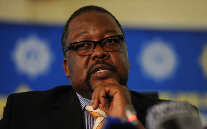 FILE:Police Minister Nkosinathi Nhleko speaks at the release of the 2013/2014 annual crime statistics in Pretoria on 19 September 2014. Picture: Sapa.