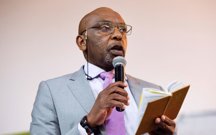 FILE: Vincent Smith, the former chair of the parliamentary committee on the proposed constitutional amendments on land expropriation, speaks during a land expropriation hearing being held in a church in Cape Town, on 4 August 2018. Picture: AFP