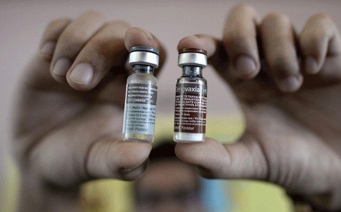 This file photo taken on 4 April 2016 shows a nurse showing vials of the anti-dengue vaccine Dengvaxia, developed by French medical giant Sanofi. Picture: AFP
