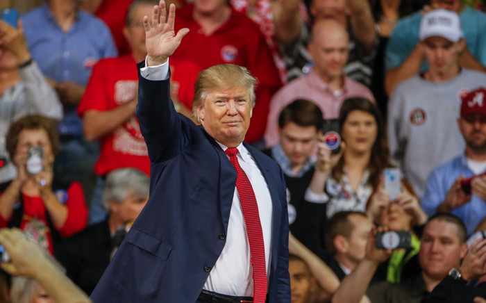 Republican US presidential candidate Donald Trump waves to the crowd after participating in a campaign town hall event at the University of South Carolina in December 2015. Picture: EPA/Erik S. Lesser.