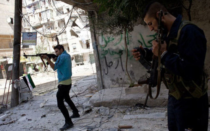 FILE: Syrian rebels take position in the Salaheddin district of the northern city of Aleppo. Picture: AFP.