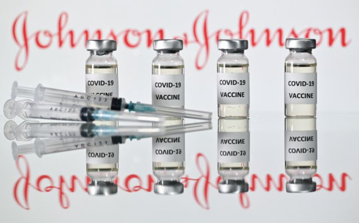 In this file photo taken on 17 November 2020 an illustration picture shows vials with COVID-19 vaccine stickers attached and syringes with the logo of US pharmaceutical company Johnson & Johnson. Picture: JUSTIN TALLIS/AFP.