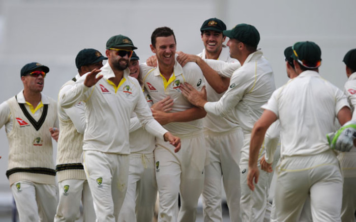 FILE: Australia players celebrate a series victory in the Ashes after defeating England in the third Test at the WACA in Perth on 18 December, 2017. Picture: AFP