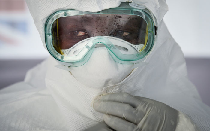 FILE: In this file photo taken on 12 December 2018 a member of the medical staff of the Ebola Treatment Unit (ETU) puts on her Personal Protective Equipment (PPE) during a weekly rehearsal at the Bwera General Hospital in Bwera bordering with DRC, western Uganda. Picture: AFP