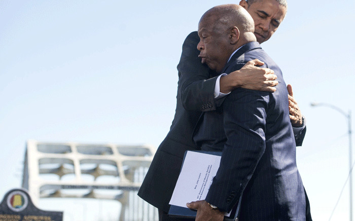 In this file photo taken on 07 March 2015 US President Barack Obama hugs US Representative John Lewis, Democrat of Georgia, one of the original marchers at Selma, during an event marking the 50th Anniversary of the Selma to Montgomery civil rights marches at the Edmund Pettus Bridge in Selma, Alabama. Picture: AFP
