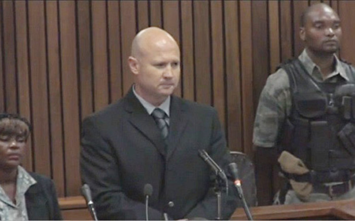 Colonel Ian van der Nest gives his testimony at the High Court in Pretoria during the Oscar Pistorius murder trial on 19 March 2014.