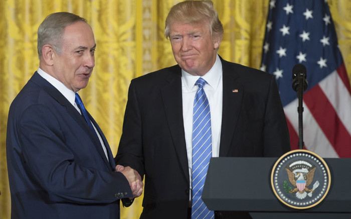 FILE: US President Donald Trump (R) and Israeli Prime Minister Benjamin Netanyahu shake hands following a joint press conference in the East Room of the White House in Washington, DC, February 15, 2017. Picture: AFP
