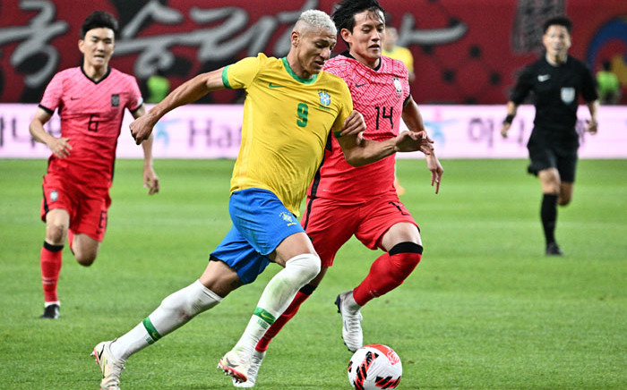 FILE: Brazil's Richarlison (front L) vies for the ball against South Korea's Hong Chul at Seoul World Cup Stadium in Seoul on 2 June 2022, during a friendly football match between South Korea and Brazil. Picture: ANTHONY WALLACE / AFP