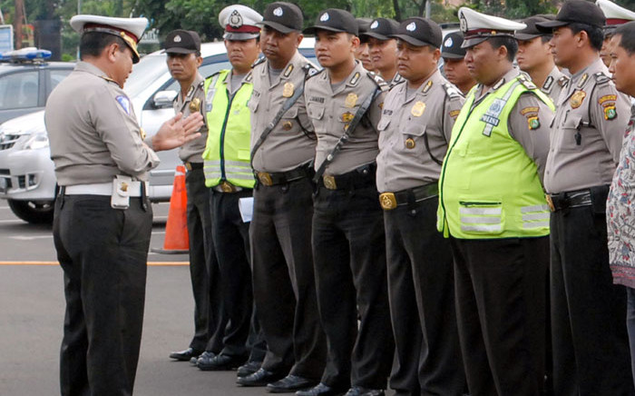 FILE: Indonesian police attend their morning briefing before taking part in their duties. Picture: AFP