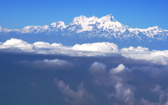 Nepalese mountains in the Himalaya range rise above the clouds. Picture: AFP