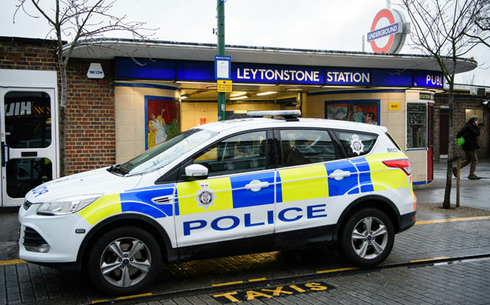 A police car is seen parked outside Leytonstone station in north London on 6 December, 2015. Police were called to reports of people being attacked at Leytonstone around 19:00 GMT on 5 December. Picture: AFP.