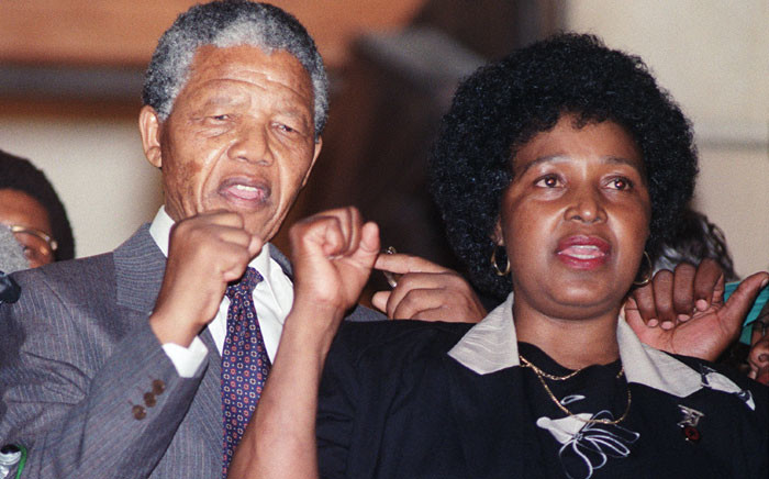 FILE: Anti-apartheid leader and ANC member Nelson Mandela and wife Winnie raise fists upon his release from Victor Verster prison, 11 February 1990 in Paarl. Picture: AFP.