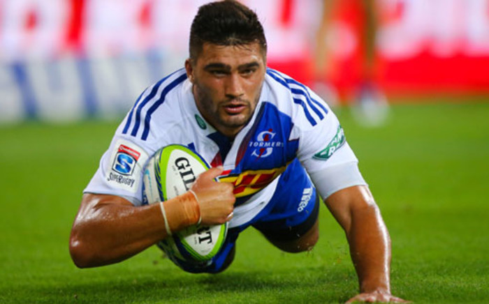 Stormers right wing Damian de Allende scores during the Super 15 rugby union match at Suncorp Stadium in Brisbane on 29 March 2014. Picture: AFP/Patrick Hamilton