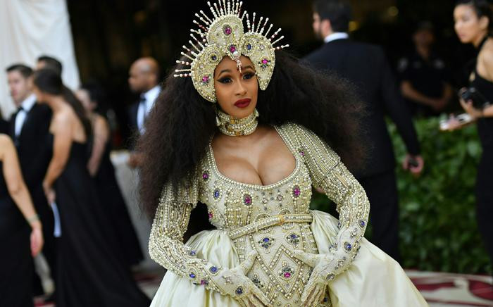 Cardi B arrives for the 2018 Met Gala in a custom Moschino outfit and bedazzled headpiece. Picture: AFP.