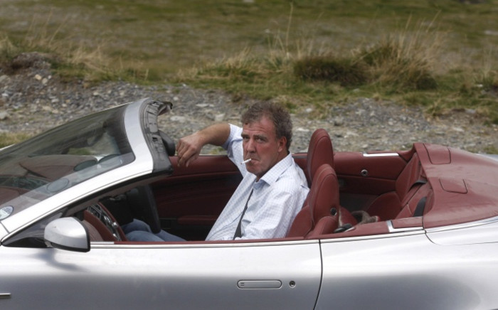FILE: In this file picture taken on September 24, 2009, British television BBC presenter of motor show ‘Top Gear’ Jeremy Clarkson is pictured driving an Aston Martin, 300 km northwest from Bucharest. Picture: AFP.