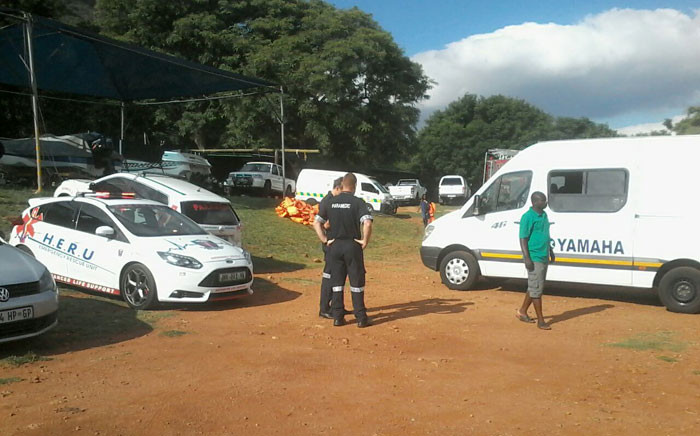 Emergency service officials at the scene of a boat fire at the Hartbeespoort Dam where four people died. Picture: iWitness.