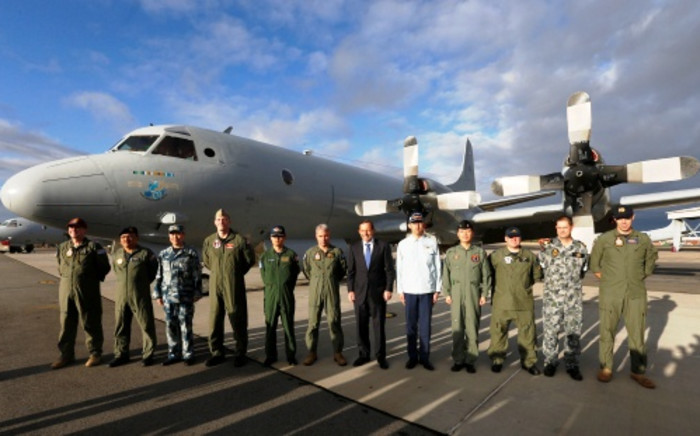FILE: Australian Prime Minister Tony Abbott (6/R) poses with leaders of international military operations currently based in Australia searching for missing Malaysia Airlines flight MH370. Picture: AFP.