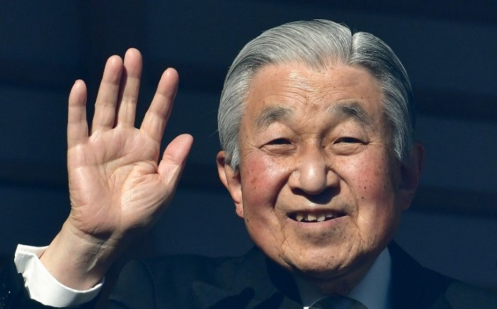 Japan's Emperor Akihito waves to well-wishers during New Year's greetings at the Imperial Palace in Tokyo on 2 January 2019. Picture: AFP