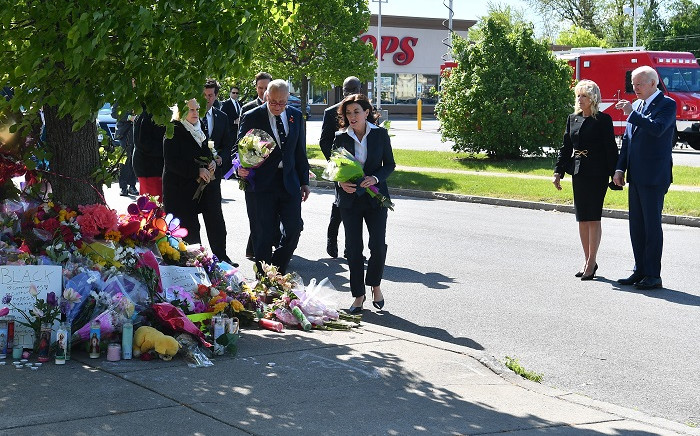 US President Joe Biden (R) and US First Lady Jill Biden (2R) look on as New York State Governor Kathy Hochul, US Senate Majority Leader Chuck Schumer (D-NY), and US Senator Kirsten Gillibrand (D-NY) arrive to place flowers at a memorial near a Tops grocery store in Buffalo, New York, on May 17, 2022.  Picture: Nicholas Kamm / AFP