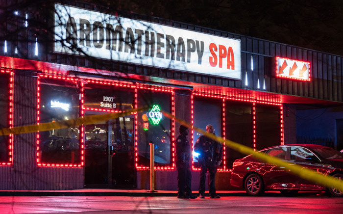 Law enforcement personnel are seen outside a massage parlor where a person was shot and killed on 16 March 2021, in Atlanta, Georgia. Picture: Elijah Nouvelage/AFP