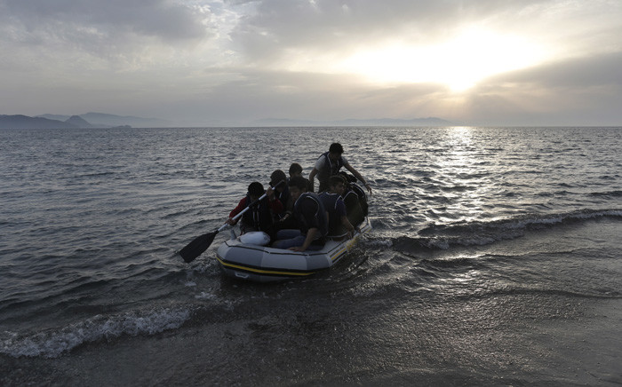 FILE: Refugees in a dinghy as they try to disembark at the coast off Kos island, near the sea border with Turkey, in Greece, in May 2015. Picture: EPA/Yannis Kolesidis.