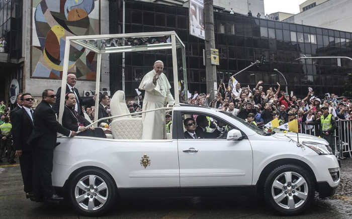 Pope Francis waves from the Popemobile on his way to the Enrique Olaya Herrera airport, in Medellin, Colombia, on 9 September, 2017. Picture: AFP.