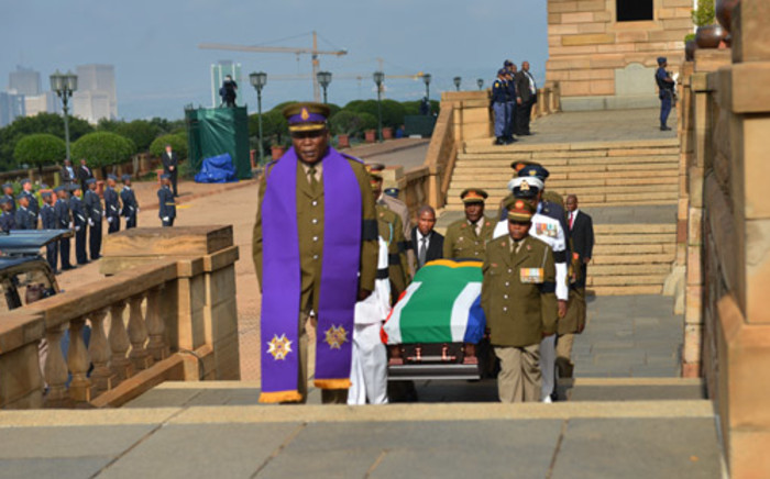 The body of former president Nelson Mandela arrives at the Union Buildings on 11 December 2013. Picture: Sapa.