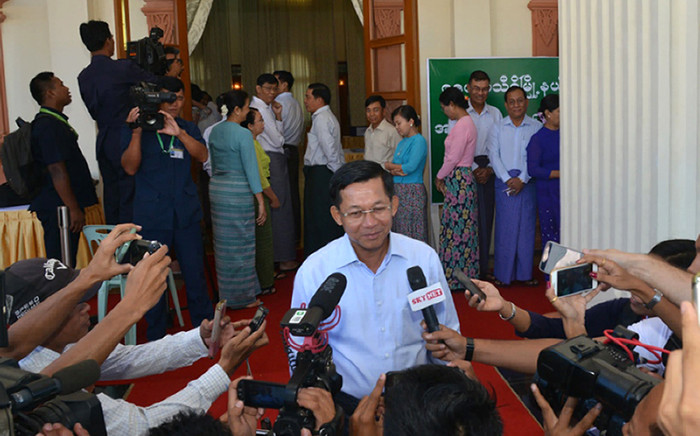Myanmars Commander-in-Chief Min Aung Hlaing talking to journalists after casting his ballot at a polling center in Naypyidaw on 8 November, 2015. Myanmars powerful army chief on 11 November, 2015 congratulated Aung San Suu Kyis party for winning a majority in landmark polls, agreeing to talks as her pro-democracy opposition appeared set for a landslide victory. Picture: AFP.