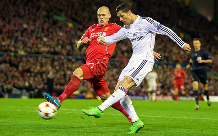 Real Madrid's Cristiano Ronaldo outruns Liverpool's Martin Skrtel and takes a shot during the Champions League Group B match at Anfield which Madrid won 3-0. Picture: Official Liverpool Facebook page.