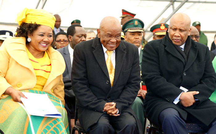 FILE: Newly appointed Lesotho Prime Minister Thomas Thabane (C), leader of the All Basotho Convention (ABC) political party, his wife 'Ma Isaiah Ramoholi Thabane (L) and Lesotho King Letsie III (R) react during Thabane's inauguration on 16 June 2017 in Maseru. Picture: AFP