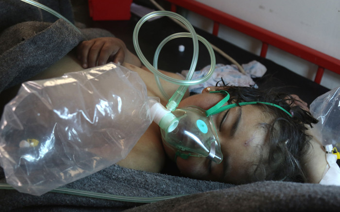 FILE: A Syrian child receives treatment following a suspected toxic gas attack in Khan Sheikhoun, a rebel-held town in the north-western Syrian Idlib province on 4 April 2017. Picture: AFP
