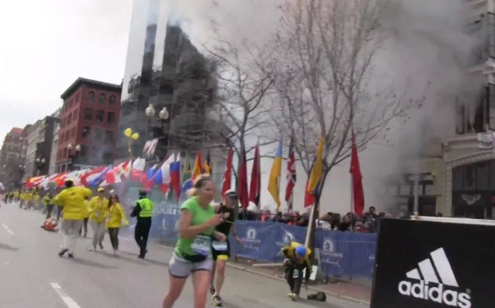 A screen grab from a private video shows the smoke after one of the explosions at the 2013 Boston Marathon.