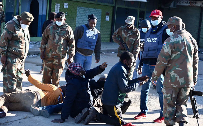 SANDF and SAPS members question suspected looters in Alexandra on 13 July 2021. Picture: @GovernmentZA/Twitter