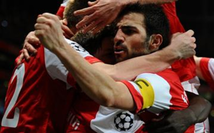 Arsenal's Spanish midfielder Cesc Fabregas celebrates a goal during the team's Champions League match against Barcelona on 16/02/11. Picture: AFP.