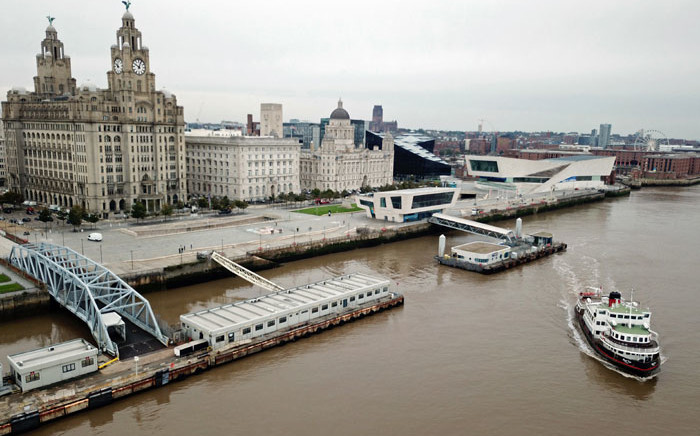 FILE: This aerial view taken in Liverpool, northwest England on 2 October 2020, shows a Mersey Ferry pulling away from Pier Head, near the Liver Building, as it travels on the River Mersey. Picture: Paul Ellis/AFP