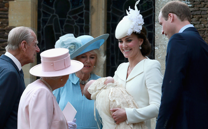 Catherine & Prince William talk to Queen Elizabeth, Prince Philip and Camilla as they leave Charlotte’s christening at St Mary Magdalene Church in Sandringham on 5 July 2015. Picture: AFP.