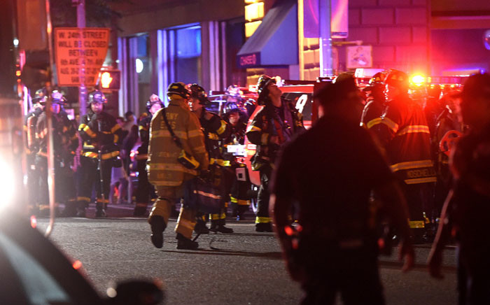 Police officers and firefighters respond to an explosion on 17 September 2016 at 23rd Street between 6th and 7th Avenues in the Chelsea neighborhood of New York City. Picture: Getty Images/AFP.