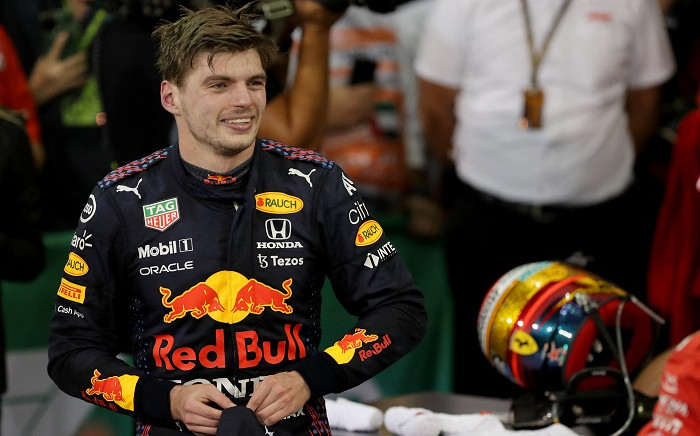 FIA Formula One World Champion Red Bull's Dutch driver Max Verstappen celebrates in the parc ferme of the Yas Marina Circuit after the Abu Dhabi Formula One Grand Prix on December 12, 2021. Picture: Kamran Jebreili / POOL / AFP